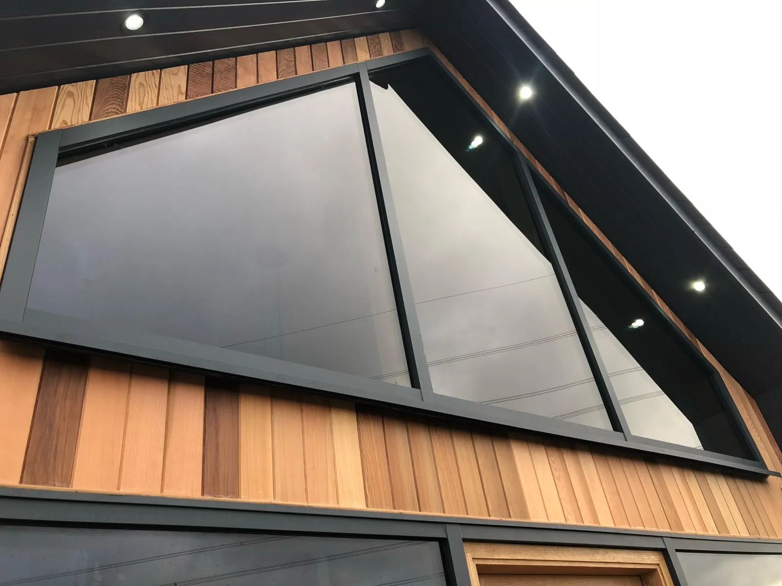 a converted traditional rural scottish property showcasing an aluminium glazed gable