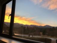 sunset over Coire an t-Sneachda in the Cairngorms, Scotland viewed over through aluminium framed window 