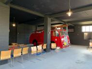 red fire engine used as inspiration for new entry way at grant's distillery 