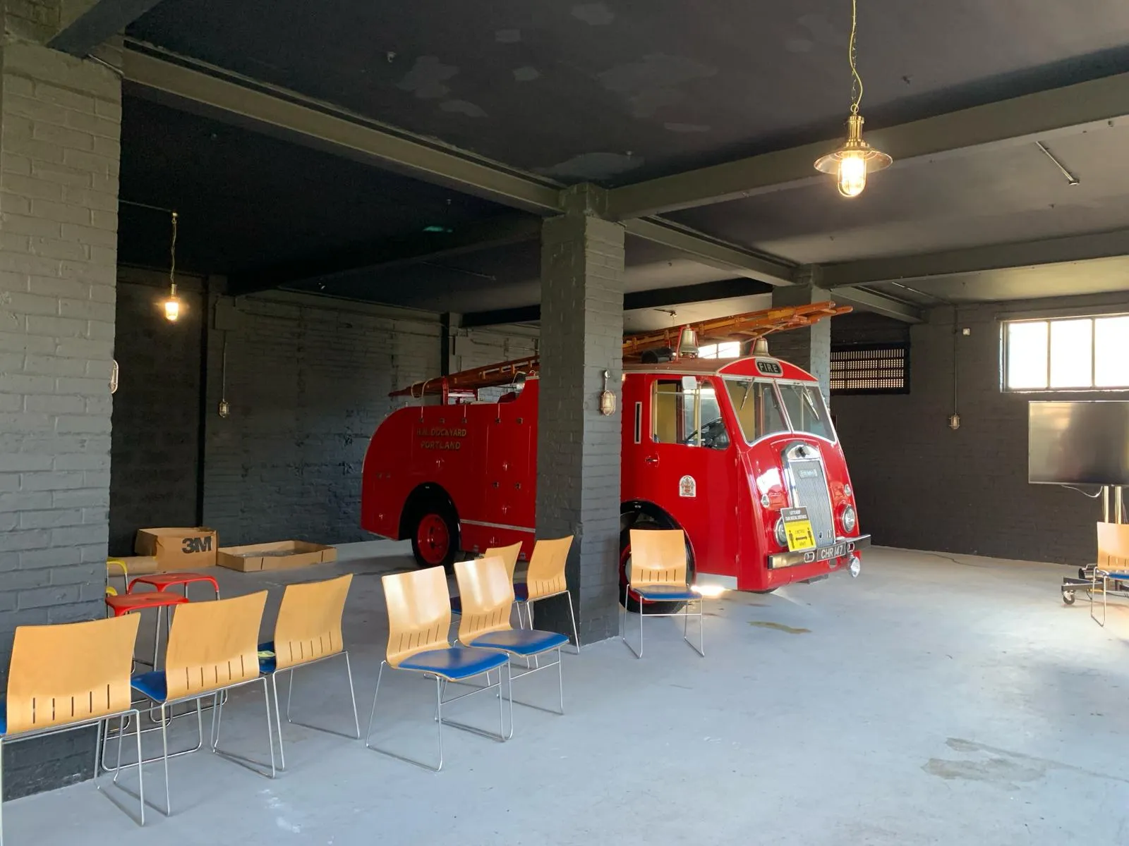 red fire engine used as inspiration for new entry way at grant's distillery 