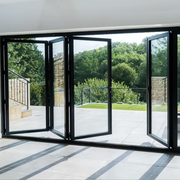 partially open bi-fold door with black finish aluminium frame and 4 full windows showing - view from inside looking out