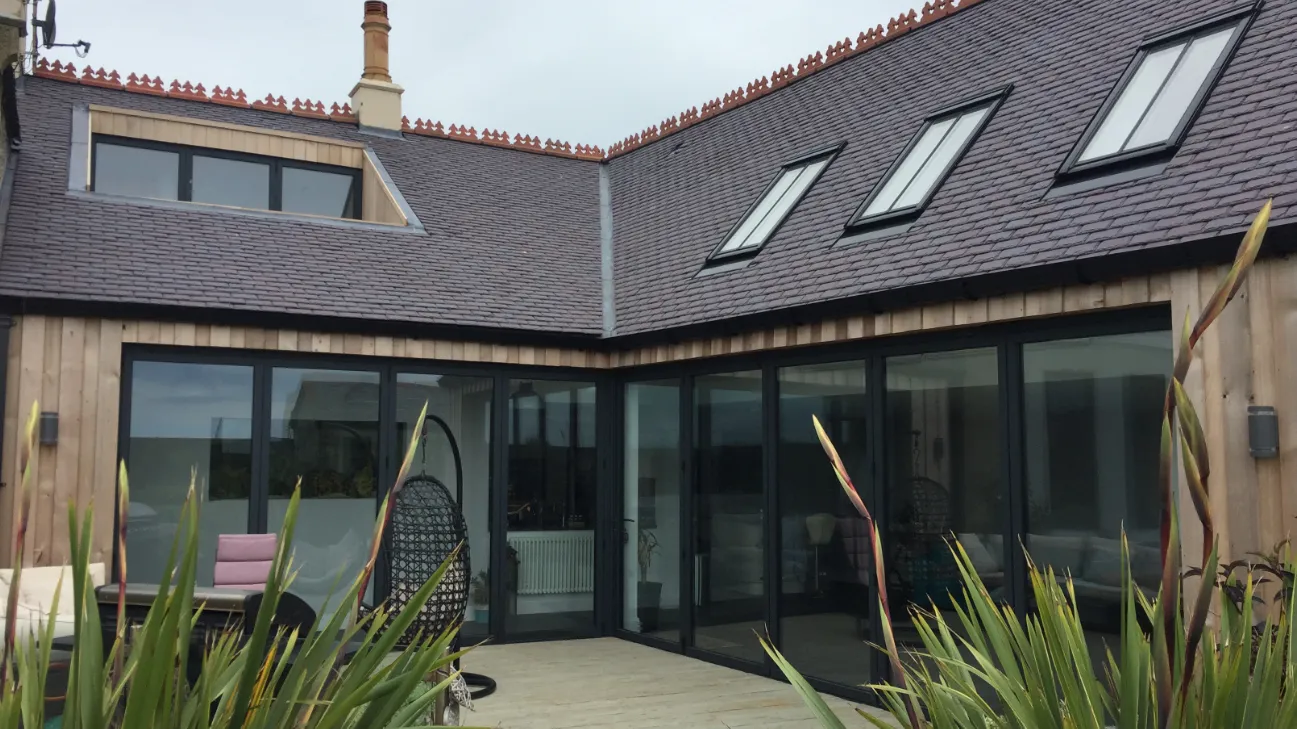 Aluminium Bi-Fold Doors in courtyard barn conversion property